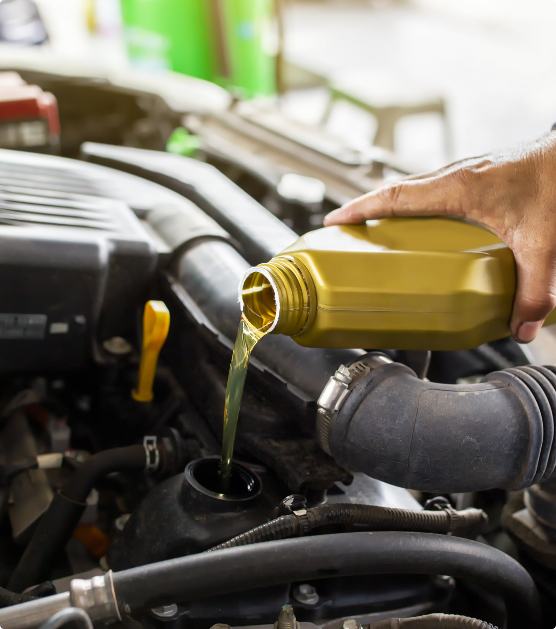 car-mechanic-replacing-pouring-fresh-oil-into-engine-maintenance-repair-service-station